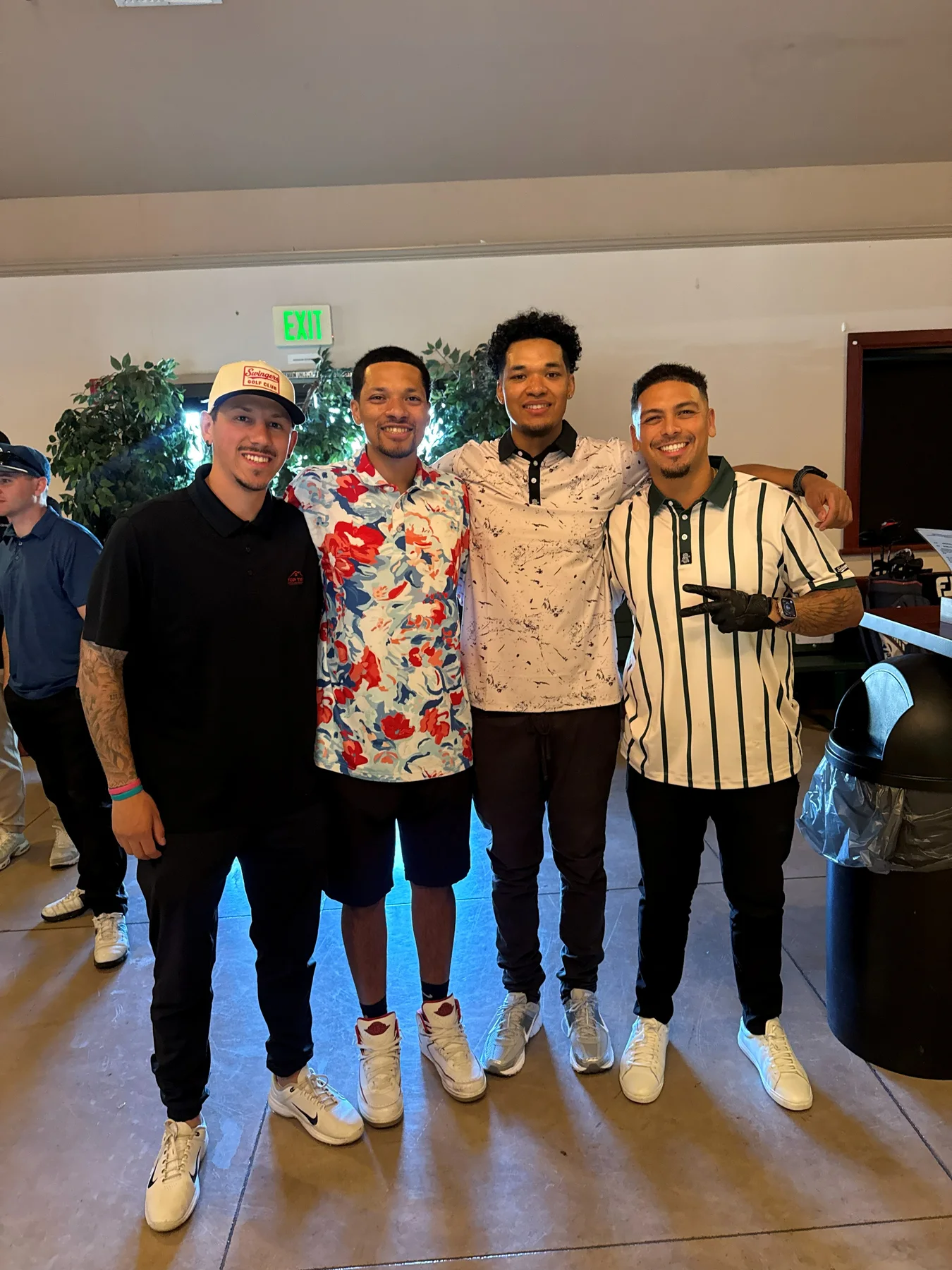 Guests wearing Swingers Club polos at the launch party.